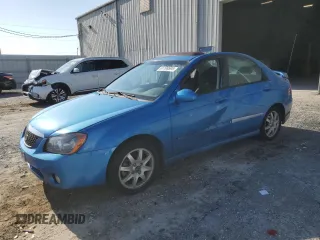 2005 Kia Spectra LX z VIN KNAFE121655113045, wystawiony jako Copart lot #61199595 z przebiegiem 156 310 mil mil oraz Szkoda całkowita • Salvage title. Historia ofert i sprzedaży dostępna na DreamBid. Obrazek 1.