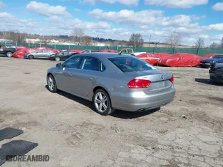2014 Volkswagen Passat SE w/Sunroof with VIN 1VWBT7A30EC075396, listed as a IAAI auction lot 41699969 with 122,252 mi miles. Bid and sale history available at carsss.com. Image 3.