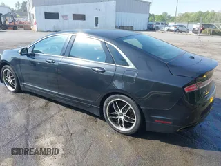 2015 Lincoln MKZ z VIN 3LN6L2G90FR602404, wystawiony jako IAAI lot #41946181 z przebiegiem 146 588 mil mil oraz . Historia ofert i sprzedaży dostępna na DreamBid. Obrazek 3.