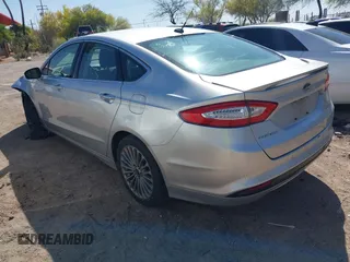 2014 Ford Fusion Titanium Hybrid with VIN 3FA6P0RUXER103516, listed as a IAAI auction lot 42004602 with 128,287 mi miles and . Bid and sale history available at carsss.com. Image 3.