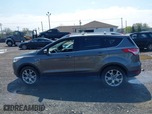 2014 Ford Escape Titanium with VIN 1FMCU9J99EUA75276, listed as a IAAI auction lot 42148537 with 163,330 mi miles and . Bid and sale history available at DreamBid. Image 14.