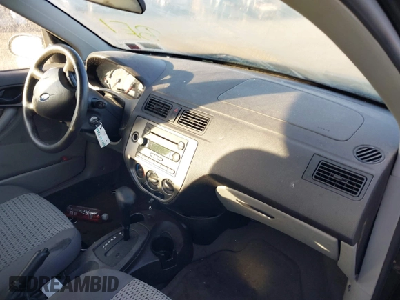 2007 Ford Focus S z VIN 1FAHP34N07W360761, wystawiony jako IAAI lot #40754946 z przebiegiem 121 371 mil mil oraz . Historia ofert i sprzedaży dostępna na DreamBid. Obrazek 5.