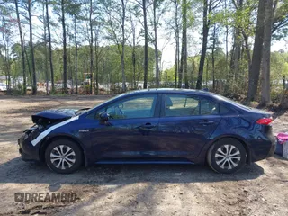 2021 Toyota Corolla Hybrid LE with VIN JTDEAMDE9MJ008582, listed as a IAAI auction lot 41998098 with 113,863 mi miles. Bid and sale history available at carsss.com. Image 13.