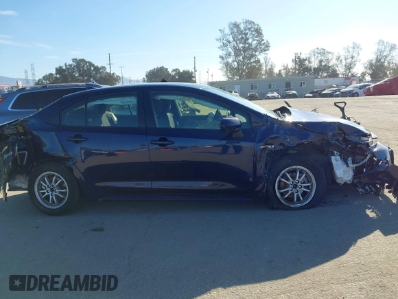 2021 Toyota Corolla Hybrid LE with VIN JTDEAMDEXMJ018828, listed as a IAAI auction lot 41633192 with 63,302 mi miles. Bid and sale history available at carsss.com. Image 14.