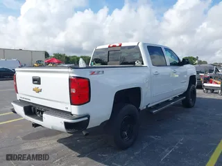 2016 Chevrolet Silverado 1500 LT with VIN 3GCUKREC3GG116107, listed as a IAAI auction lot 41490638 with 93,669 mi miles. Bid and sale history available at carsss.com. Image 4.