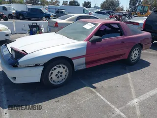 1986 Toyota Supra z VIN JT2MA70J2G0023623, wystawiony jako IAAI lot #42100560 z przebiegiem 182 271 mil mil oraz . Historia ofert i sprzedaży dostępna na DreamBid. Obrazek 2.
