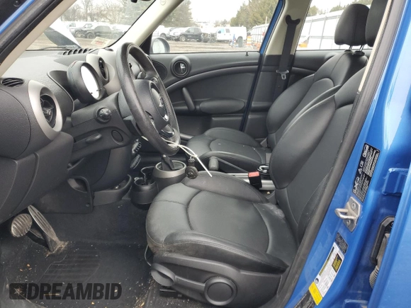 2012 MINI Countryman S with VIN WMWZC5C57CWL62540, listed as a Copart auction lot 43735105 with 86,558 mi miles and Salvage Title. Bid and sale history available at DreamBid. Image 7.