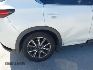 2018 Mazda CX-5 Grand Touring with VIN JM3KFADM2J1422512, listed as a IAAI auction lot 42010801 with 48,567 mi miles and . Bid and sale history available at DreamBid. Image 6.