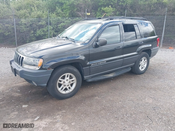 2003 Jeep Grand Cherokee Laredo with VIN 1J8GW48S63C596866, listed as a IAAI auction lot 42060430 with 129,849 mi miles. Bid and sale history available at carsss.com. Image 2.