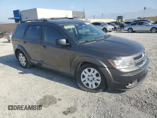 2014 Dodge Journey American Value with VIN 3C4PDCABXET277897, listed as a Copart auction lot 60566735 with 113,343 mi miles and Salvage title. Bid and sale history available at DreamBid. Image 4.