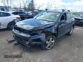 2013 Volkswagen Touareg Lux with VIN WVGEF9BP4DD006851, listed as a IAAI auction lot 41983791 with 115,551 mi miles and . Bid and sale history available at DreamBid. Image 2.