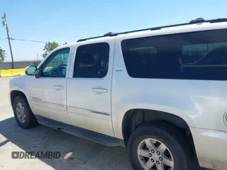 2012 GMC Yukon XL SLT z VIN 1GKS2LE74CR100438, wystawiony jako IAAI lot #42319226 z przebiegiem 172 628 mil mil oraz . Historia ofert i sprzedaży dostępna na DreamBid. Obrazek 14.
