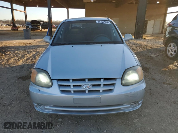 2003 Hyundai Accent GL with VIN KMHCG45C93U496038, listed as a Copart auction lot 87260904 with 104,251 mi miles and Salvage Title. Bid and sale history available at carsss.com. Image 5.