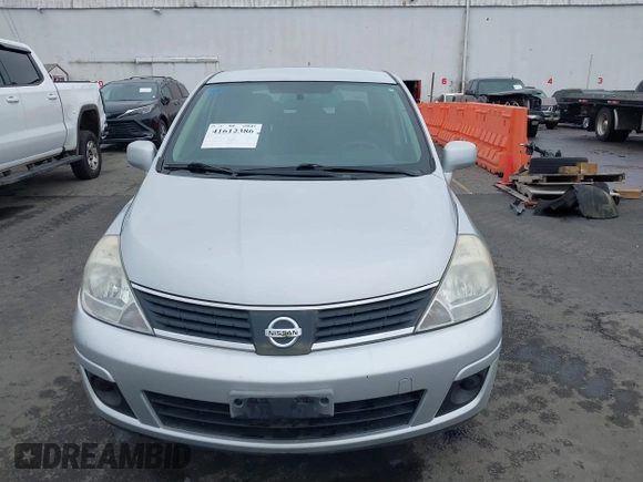 2007 Nissan Versa 1.8 SL with VIN 3N1BC11E97L447829, listed as a IAAI auction lot 41612386 with 123,500 mi miles. Bid and sale history available at carsss.com. Image 12.