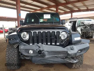 2019 Jeep Wrangler Unlimited Sport S with VIN 1C4HJXDN2KW630780, listed as a IAAI auction lot 41817573 with 56,113 mi miles and . Bid and sale history available at DreamBid. Image 12.