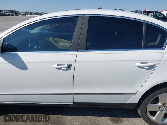 2009 Volkswagen Passat z VIN WVWJK93C29P033434, wystawiony jako IAAI lot #41698532 z przebiegiem 129 256 mil mil oraz . Historia ofert i sprzedaży dostępna na DreamBid. Obrazek 14.