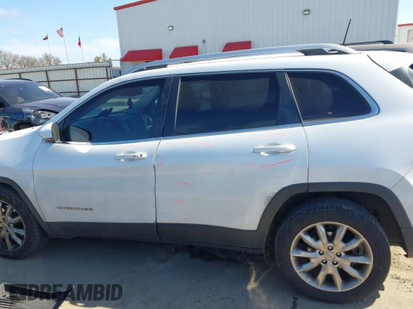 2016 Jeep Cherokee Limited with VIN 1C4PJLDB8GW256788, listed as a IAAI auction lot 41657339 with 104,630 mi miles. Bid and sale history available at carsss.com. Image 14.