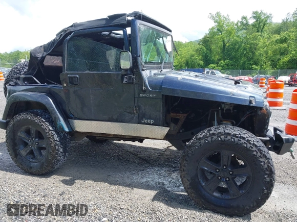 2003 Jeep Wrangler Sport z VIN 1J4FA49S53P317779, wystawiony jako IAAI lot #42388780 z przebiegiem Nie podano mil oraz . Historia ofert i sprzedaży dostępna na DreamBid. Obrazek 12.
