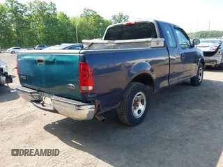 2000 Ford F-150 XL with VIN 1FTZX1723YNB00043, listed as a IAAI auction lot 42215601 with Not provided miles and . Bid and sale history available at DreamBid. Image 4.