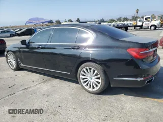 2017 BMW 7 Series 740i with VIN WBA7E2C50HG739565, listed as a Copart auction lot 64584885 with 114,496 mi miles and Salvage title. Bid and sale history available at DreamBid. Image 2.