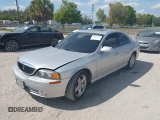 2000 Lincoln LS with VIN 1LNHM87A4YY886613, listed as a IAAI auction lot 41793515 with 144,061 mi miles. Bid and sale history available at carsss.com. Image 2.