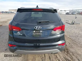 2017 Hyundai Santa Fe 2.4L z VIN 5XYZU3LB5HG425830, wystawiony jako IAAI lot #41428863 z przebiegiem 76 366 mil mil oraz . Historia ofert i sprzedaży dostępna na DreamBid. Obrazek 16.