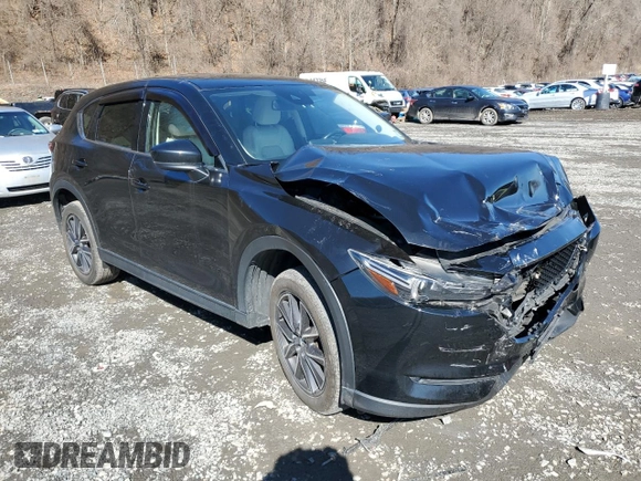 2017 Mazda CX-5 Grand Touring with VIN JM3KFBDL6H0211374, listed as a Copart auction lot 49079775 with 142,164 mi miles and Salvage Title. Bid and sale history available at carsss.com. Image 4.