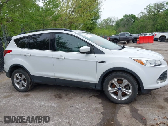 2016 Ford Escape SE with VIN 1FMCU9GX1GUC04085, listed as a IAAI auction lot 42126826 with 130,728 mi miles. Bid and sale history available at carsss.com. Image 13.
