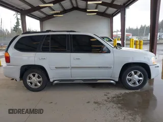 2003 GMC Envoy SLE with VIN 1GKDT13SX32319740, listed as a IAAI auction lot 41923578 with 210,811 mi miles. Bid and sale history available at carsss.com. Image 13.