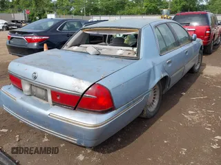 2000 Mercury Grand Marquis LS z VIN 2MEFM75W2YX740018, wystawiony jako IAAI lot #42255754 z przebiegiem 318 651 mil mil oraz . Historia ofert i sprzedaży dostępna na DreamBid. Obrazek 4.