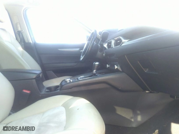 2019 Mazda CX-5 Touring with VIN JM3KFBCM5K0633668, listed as a IAAI auction lot 41617142 with 57,809 mi miles. Bid and sale history available at carsss.com. Image 5.