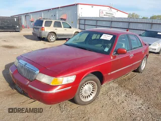 2000 Mercury Grand Marquis LS z VIN 2MEFM75W1YX736283, wystawiony jako IAAI lot #41879063 z przebiegiem 114 535 mil mil oraz . Historia ofert i sprzedaży dostępna na DreamBid. Obrazek 2.