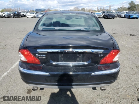 2004 Jaguar X-Type with VIN SAJEA51C74WD56736, listed as a Copart auction lot 48038295 with 115,817 mi miles and Salvage Title. Bid and sale history available at DreamBid. Image 6.