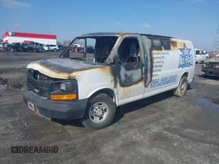 2014 Chevrolet Express Cargo Van with VIN 1GCWGGBA3E1214227, listed as a IAAI auction lot 41571911 with 1 mi miles. Bid and sale history available at carsss.com. Image 2.