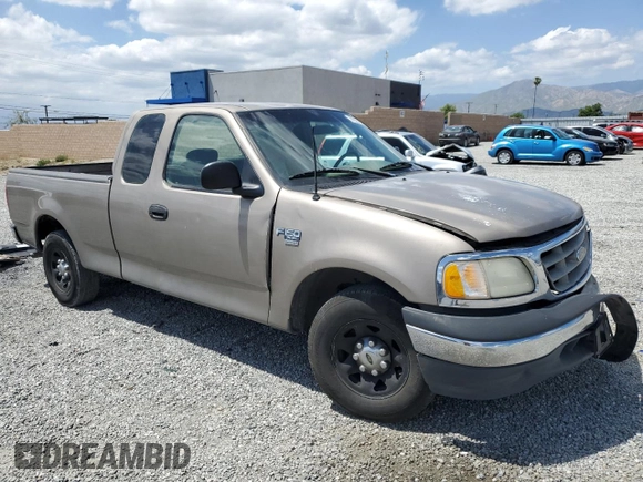 2001 Ford F-150 with VIN 1FTPX17L21NA37619, listed as a Copart auction lot 56922485 with 212,148 mi miles and Salvage title. Bid and sale history available at DreamBid. Image 4.