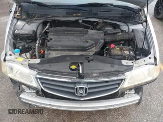 2004 Honda Odyssey EX-L with VIN 5FNRL18934B076486, listed as a IAAI auction lot 42315160 with 209,467 mi miles and . Bid and sale history available at DreamBid. Image 10.