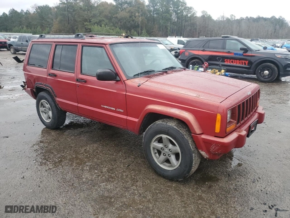 1999 Jeep Cherokee Sport with VIN 1J4FT68S1XL601799, listed as a Copart auction lot 83881844 with 203,572 mi miles and Salvage Title. Bid and sale history available at carsss.com. Image 4.
