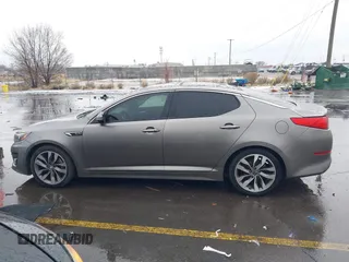 2015 Kia Optima SX Turbo with VIN 5XXGR4A66FG361755, listed as a IAAI auction lot 41199887 with 114,179 mi miles. Bid and sale history available at carsss.com. Image 14.