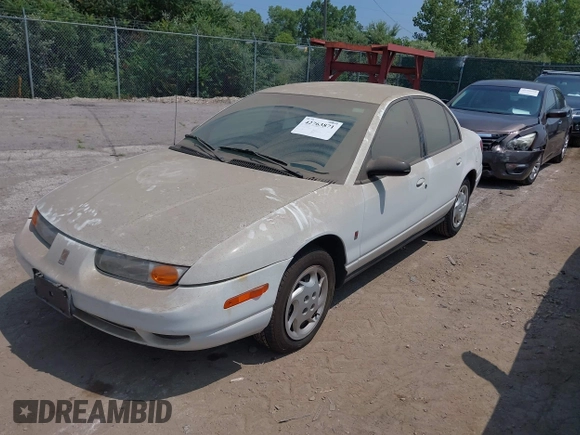 2002 Saturn SL z VIN 1G8ZK52772Z218812, wystawiony jako IAAI lot #42763871 z przebiegiem 86 338 mil mil oraz . Historia ofert i sprzedaży dostępna na DreamBid. Obrazek 2.