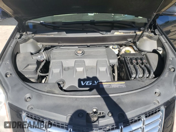 2013 Cadillac SRX Premium Collection z VIN 3GYFNEE37DS622065, wystawiony jako Copart lot #57468065 z przebiegiem 108 796 mil mil oraz Szkoda całkowita • Salvage title. Historia ofert i sprzedaży dostępna na DreamBid. Obrazek 11.