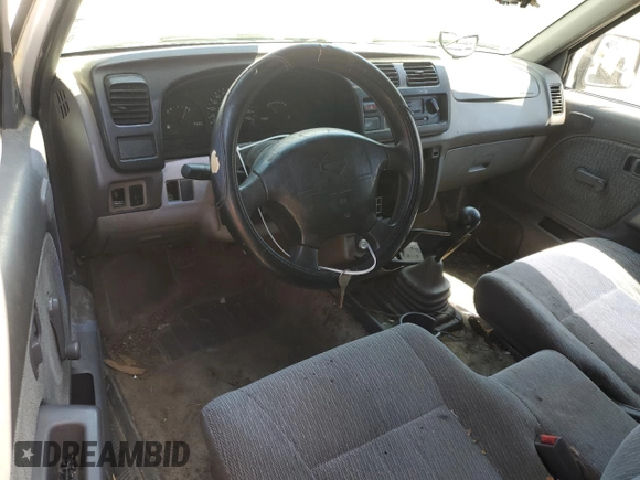 1999 Nissan Frontier XE with VIN 1N6DD26S3XC326231, listed as a Copart auction lot 51710615 with 228,174 mi miles and Salvage title. Bid and sale history available at DreamBid. Image 8.