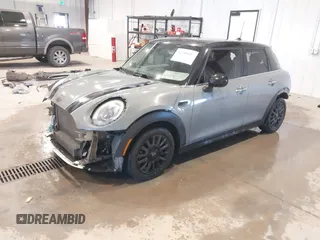 2015 MINI Hardtop 4 Door with VIN WMWXS5C58FT830081, listed as a IAAI auction lot 41345037 with 93,545 mi miles and . Bid and sale history available at DreamBid. Image 2.