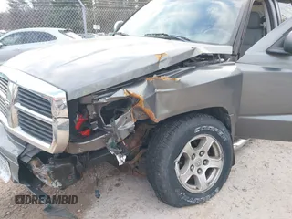 2007 Dodge Dakota SLT z VIN 1D7HW48P57S216313, wystawiony jako IAAI lot #41319321 z przebiegiem 116 712 mil mil oraz . Historia ofert i sprzedaży dostępna na DreamBid. Obrazek 6.