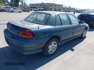 1998 Pontiac Grand Am SE with VIN 1G2NE52M2WC712123, listed as a IAAI auction lot 41939392 with 307,145 mi miles. Bid and sale history available at carsss.com. Image 4.