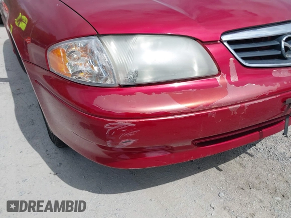 2000 Mazda 626 LX with VIN 1YVGF22C8Y5115891, listed as a IAAI auction lot 42121137 with 186,165 mi miles. Bid and sale history available at carsss.com. Image 6.