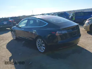 2018 Tesla Model 3 Long Range Battery with VIN 5YJ3E1EA2JF014975, listed as a IAAI auction lot 41319407 with 106,301 mi miles and . Bid and sale history available at DreamBid. Image 3.