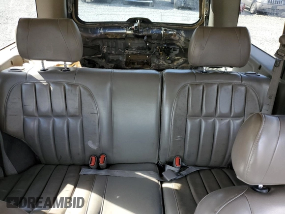 1999 Jeep Grand Cherokee Limited with VIN 1J4GW68S2XC677334, listed as a Copart auction lot 74152054 with 242,220 mi miles and Salvage Title. Bid and sale history available at carsss.com. Image 10.