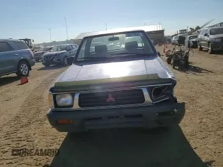 1994 Mitsubishi Mighty Max z VIN JA7LS21G4RP009588, wystawiony jako Copart lot #60519834 z przebiegiem 123 918 mil mil oraz Szkoda całkowita • Salvage title. Historia ofert i sprzedaży dostępna na DreamBid. Obrazek 11.