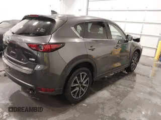 2017 Mazda CX-5 Grand Touring with VIN JM3KFADLXH0151593, listed as a IAAI auction lot 41823378 with 149,299 mi miles. Bid and sale history available at carsss.com. Image 4.