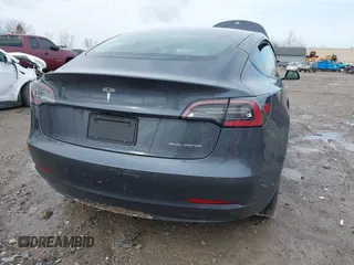 2022 Tesla Model 3 Long Range with VIN 5YJ3E1EB8NF201023, listed as a IAAI auction lot 41942943 with 30,635 mi miles and . Bid and sale history available at DreamBid. Image 4.